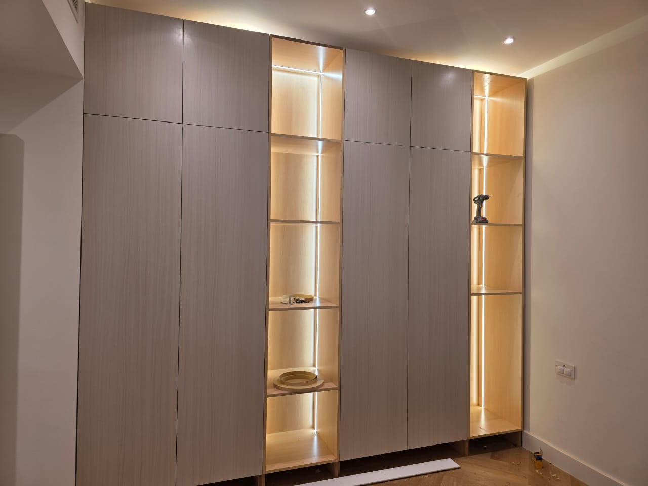 Victory Heights — Sports City, Dubai: tall wardrobe with LED display shelving